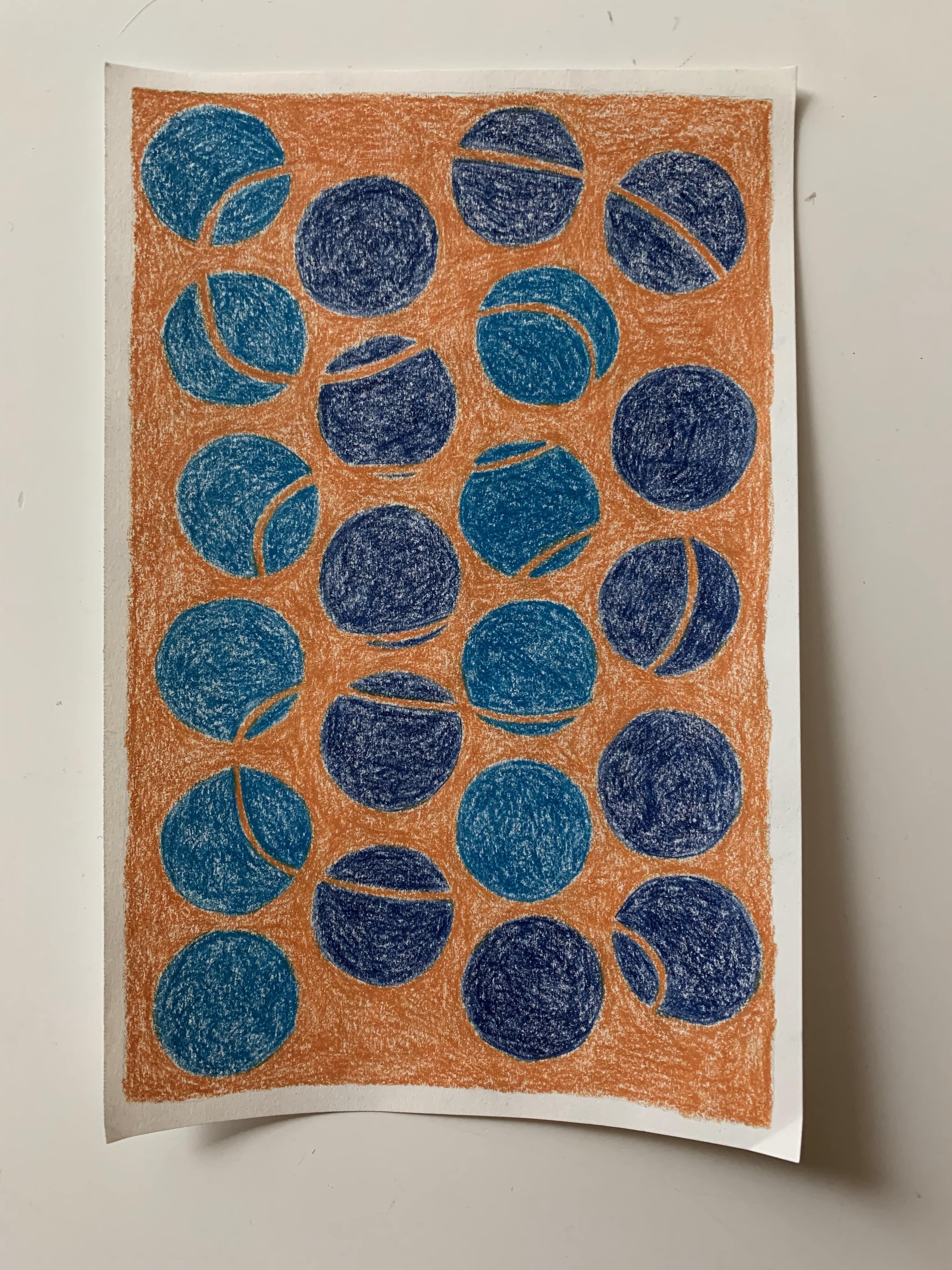 orange, blue, and teal colored pencil dots/circles drawing