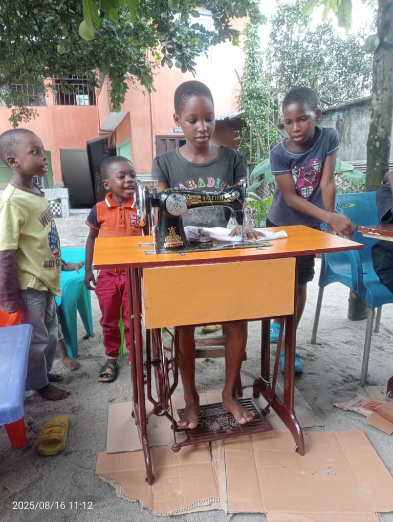 Orphanage-child-operating-sewing-machine