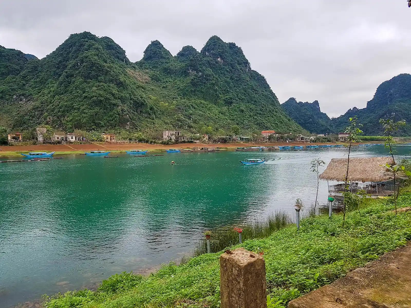 A quiet morning watching the boats pass by in Phong Nha