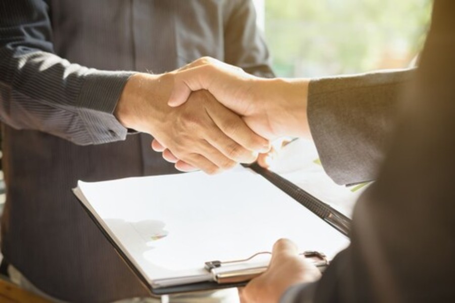 hand receiving offer letter