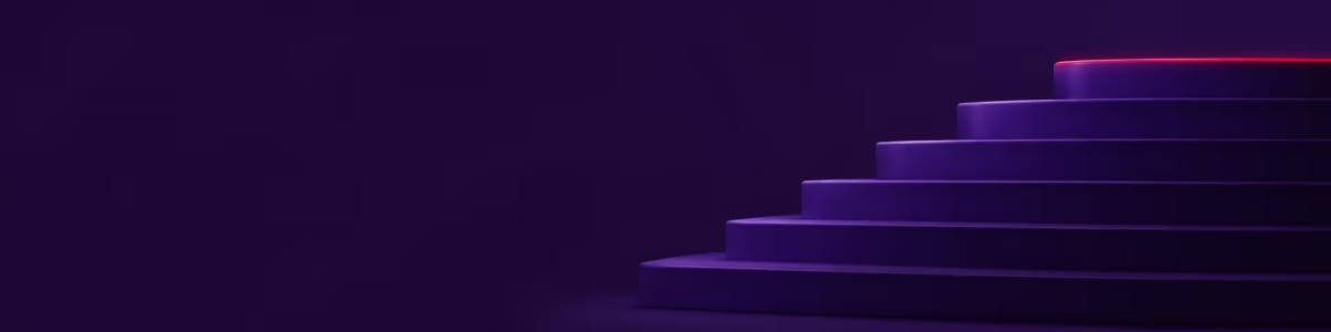 Abstract purple steps ascending toward a red-lit top step.