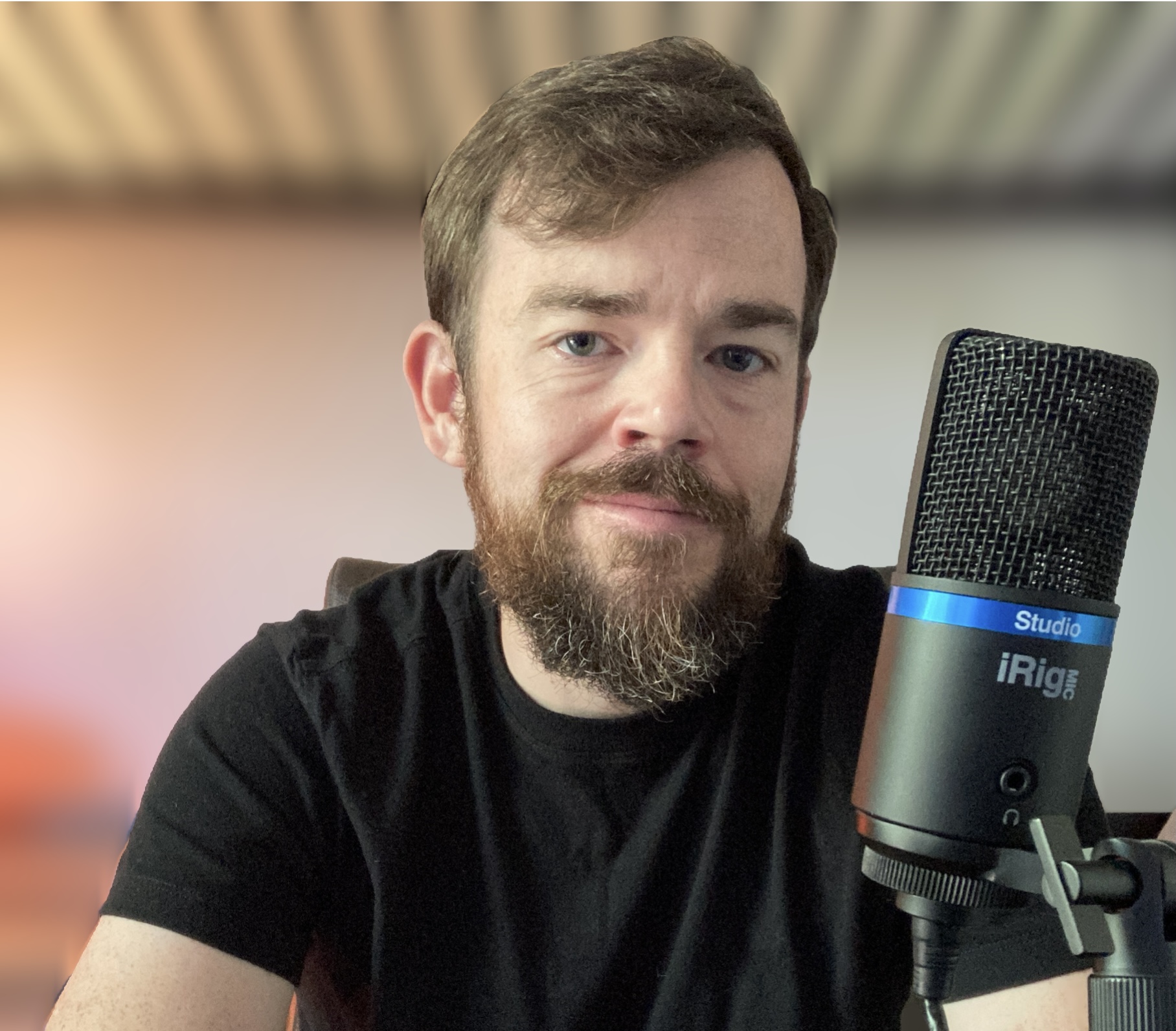 Cameron Ward, voice over talent, with a microphone