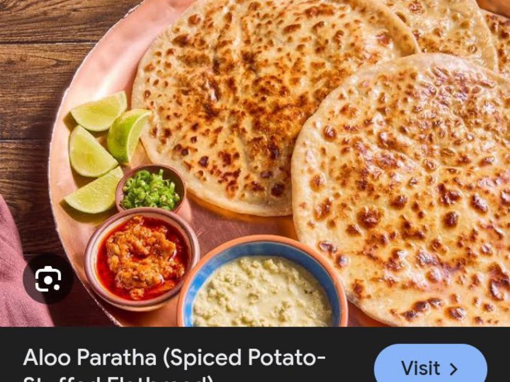 Aalo ke Paratha Raita Chatni Salad Jira Aalo