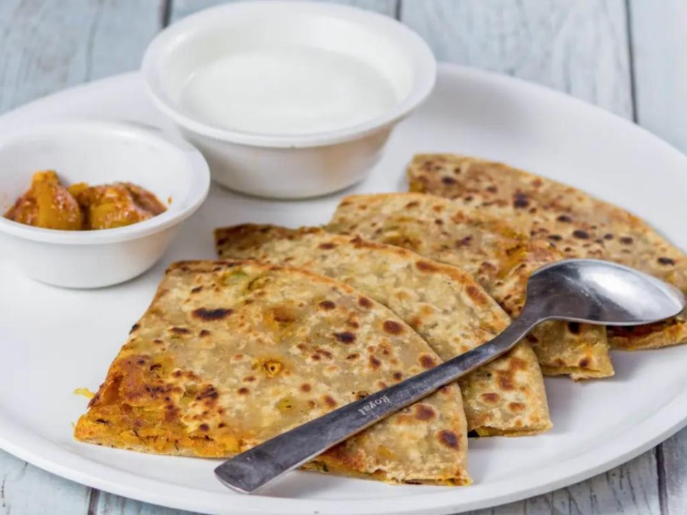 ALOO PRATHA (4 ) , LOUKI RAITA WITH ACHAR AND SALAD.