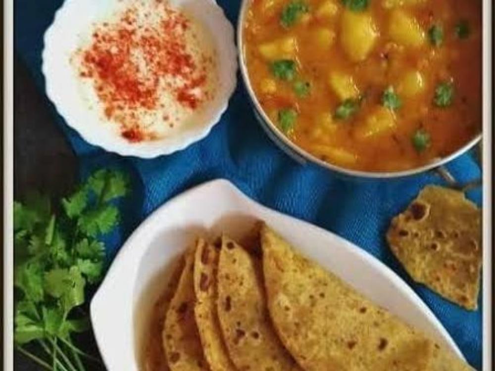 Aloo Tamatar ki Sabzi, Five Paratha, Salad, Achar