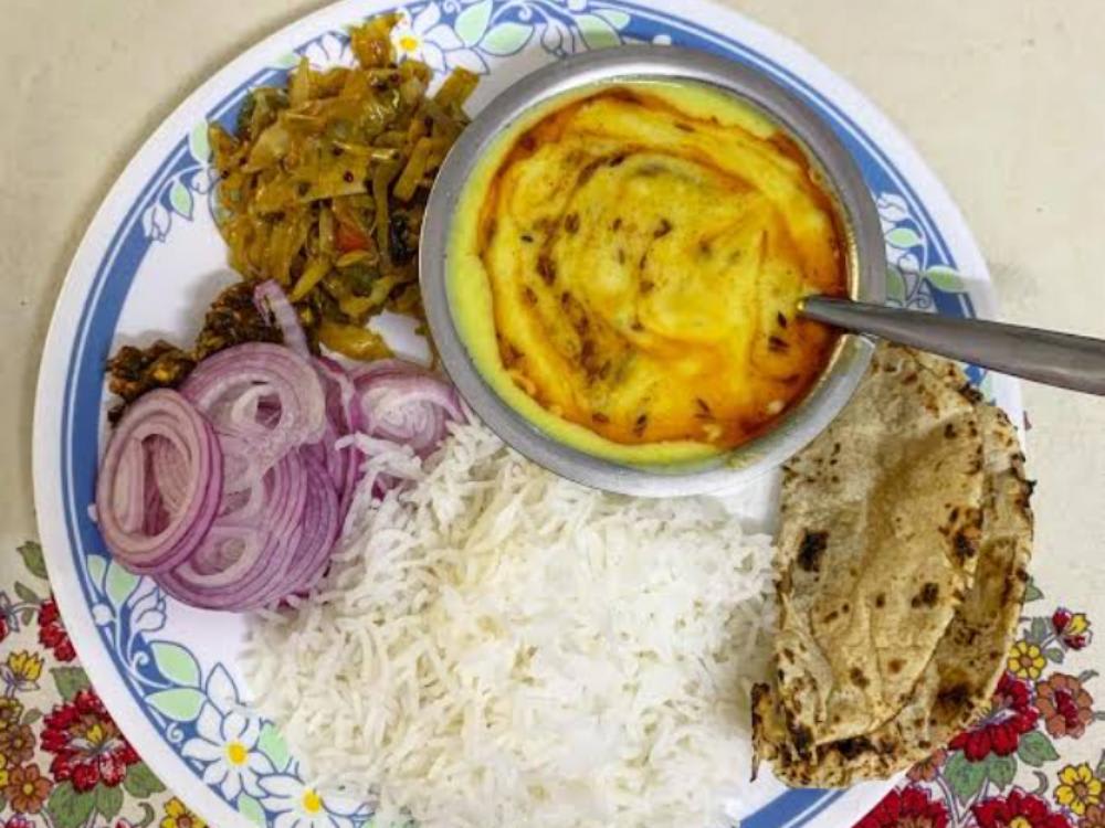 Kadhi Rice Patta Gobhi ki Sabzi Salad Four Roti