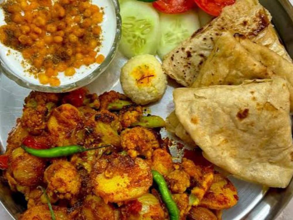 Aalu Gobhi ki Sabzi Four Roti and Bundi ka Raita and Salad