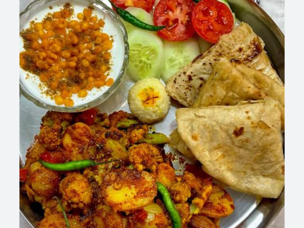 Aalu Gobhi ki Sabzi Bundi ka Raita Five Roti Salad