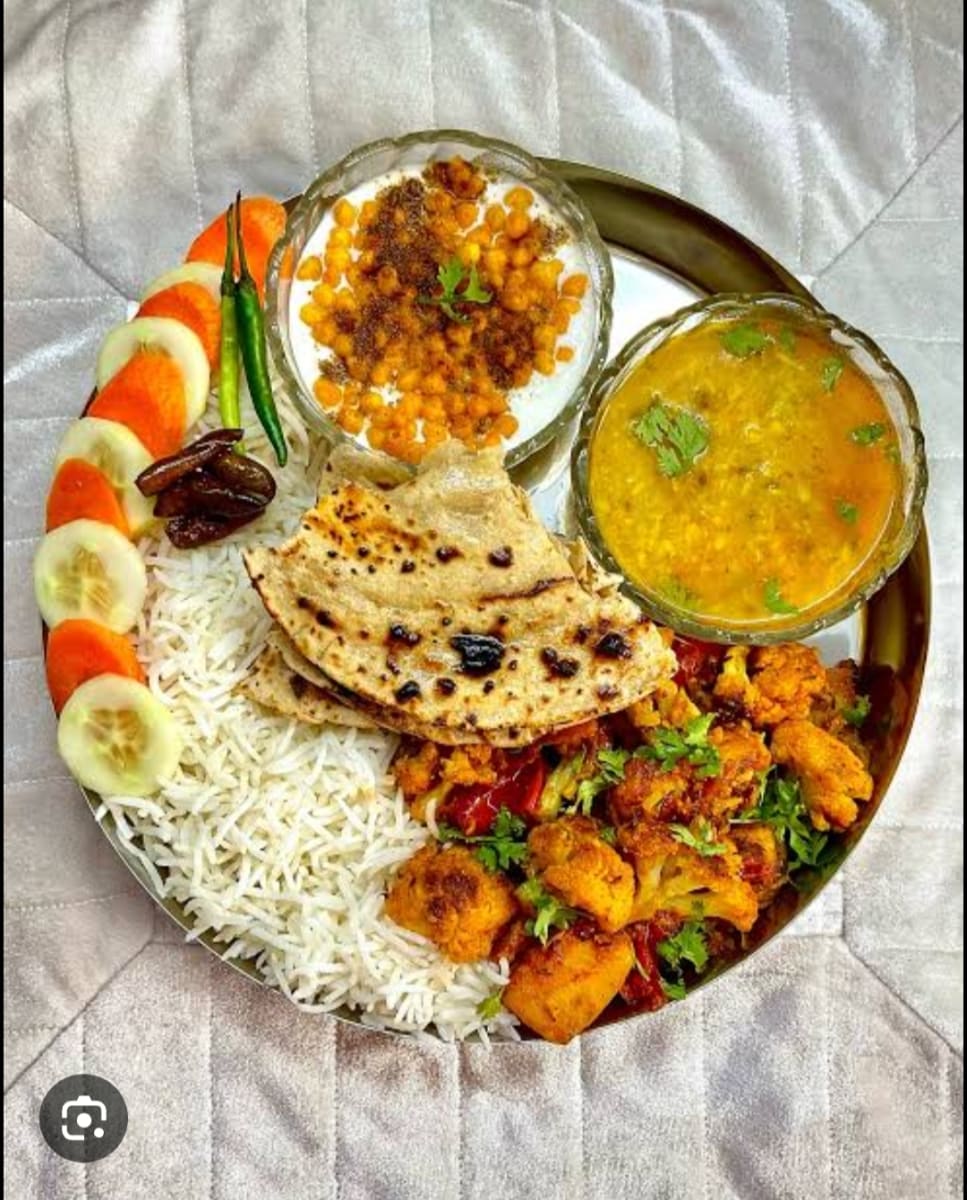 Aalu gobhi daal chawal roti salad — home-cooked meal by RADHA KISORI KI RASOI on Nomio