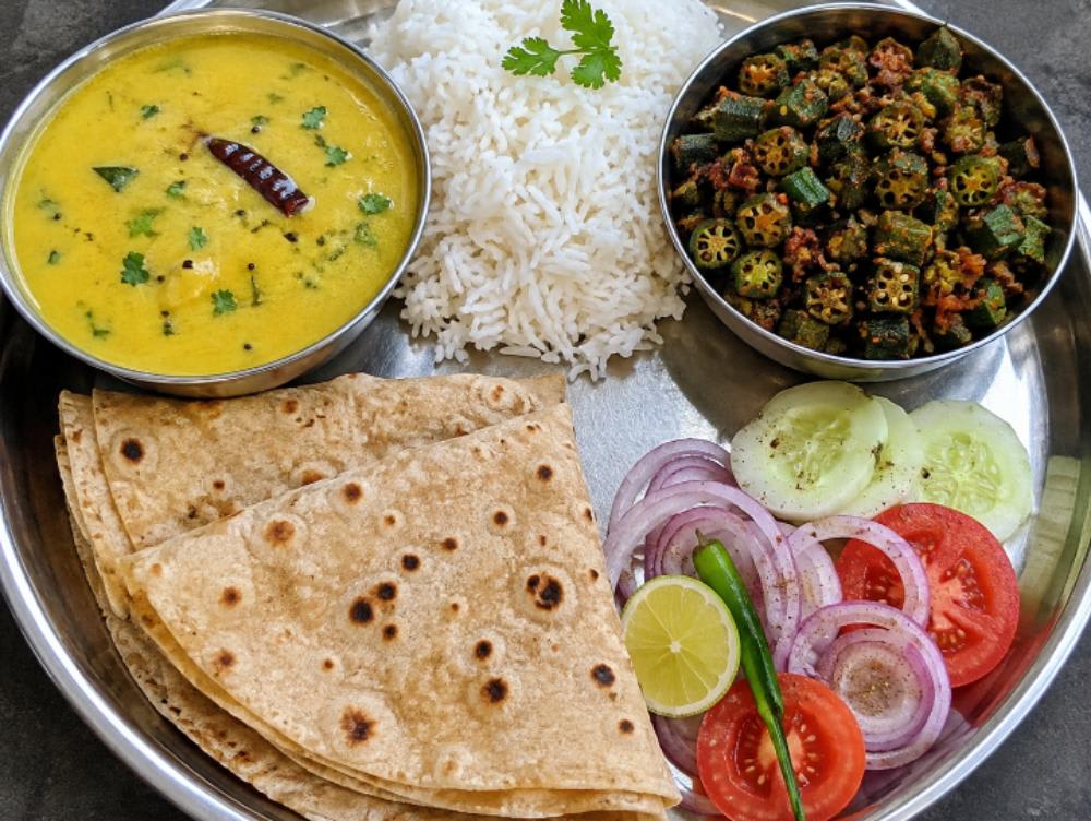 Kadhi chawal bhindi ki sabji 4 roti salad — home-cooked meal by Sapna Ki Rasoi on Nomio
