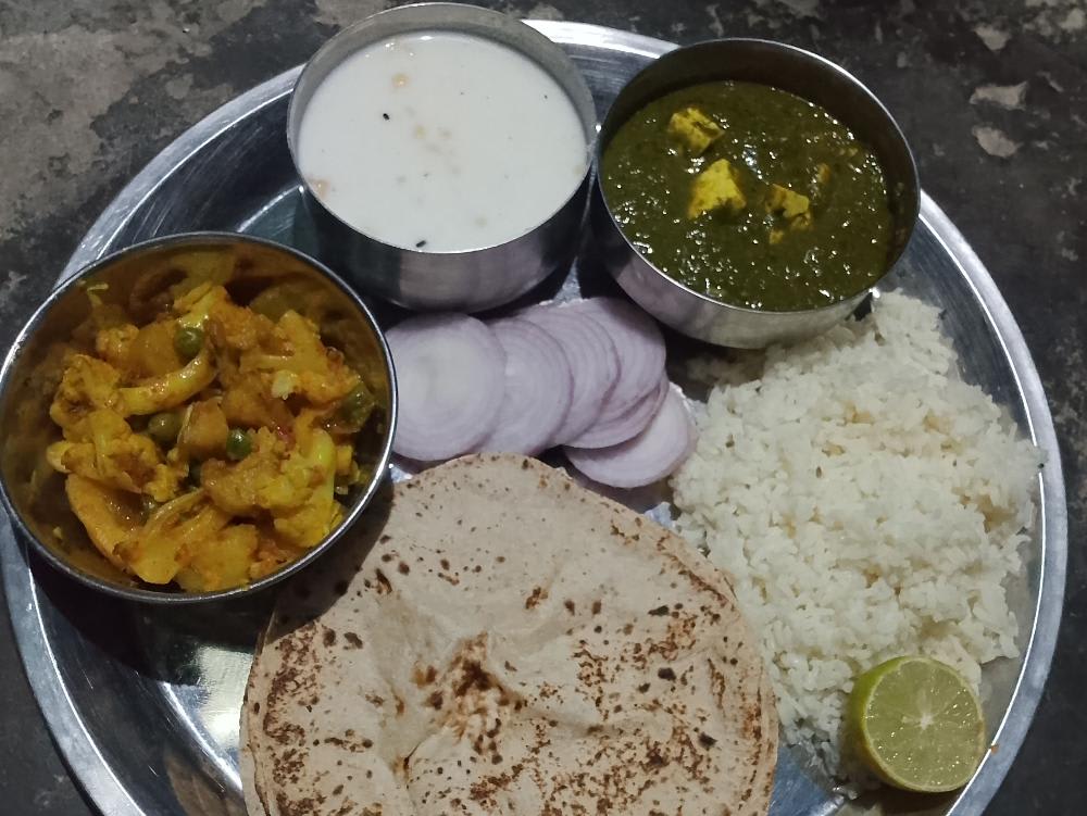 Aaloo gobhi matar palak paneer rice salad raita