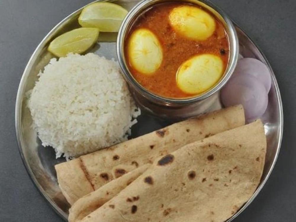 Egg curry rice roti with salad