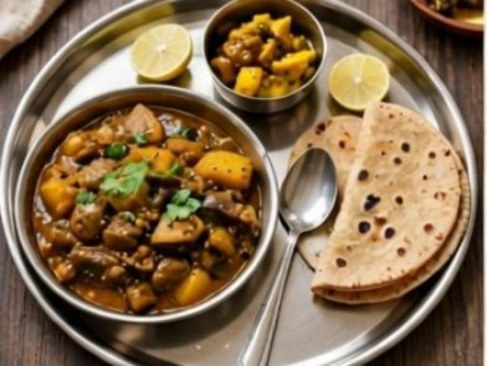 Baingan aalu ki sabji roti lemon and Achar