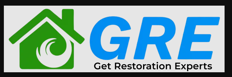 Certified water damage restoration technicians performing emergency structural drying and water extraction inside a residential property