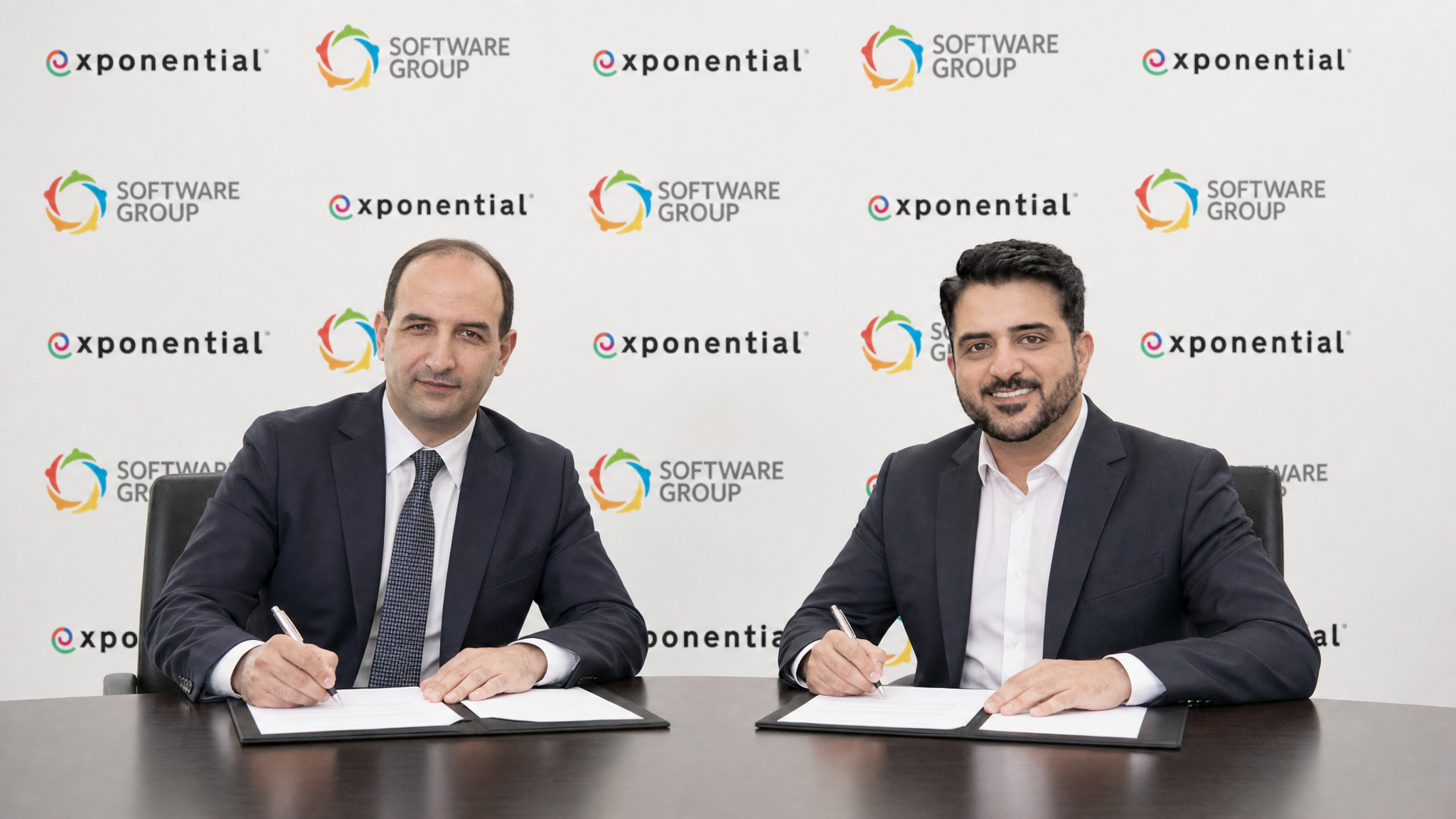 Muhammad Raziq, CEO of Exponential, and Kalin Radev, CEO of Software Group, at the partnership signing ceremony.