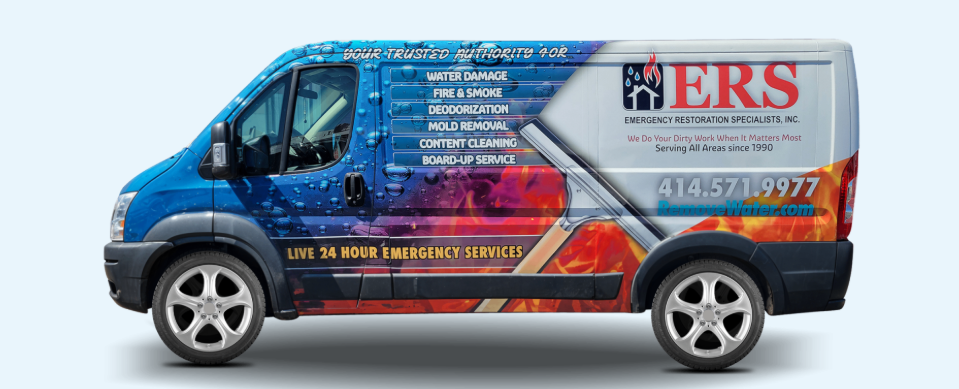Emergency Restoration Specialists technician performing water extraction and structural drying procedures inside a commercial property following a water damage incident in the Milwaukee metropolitan area.