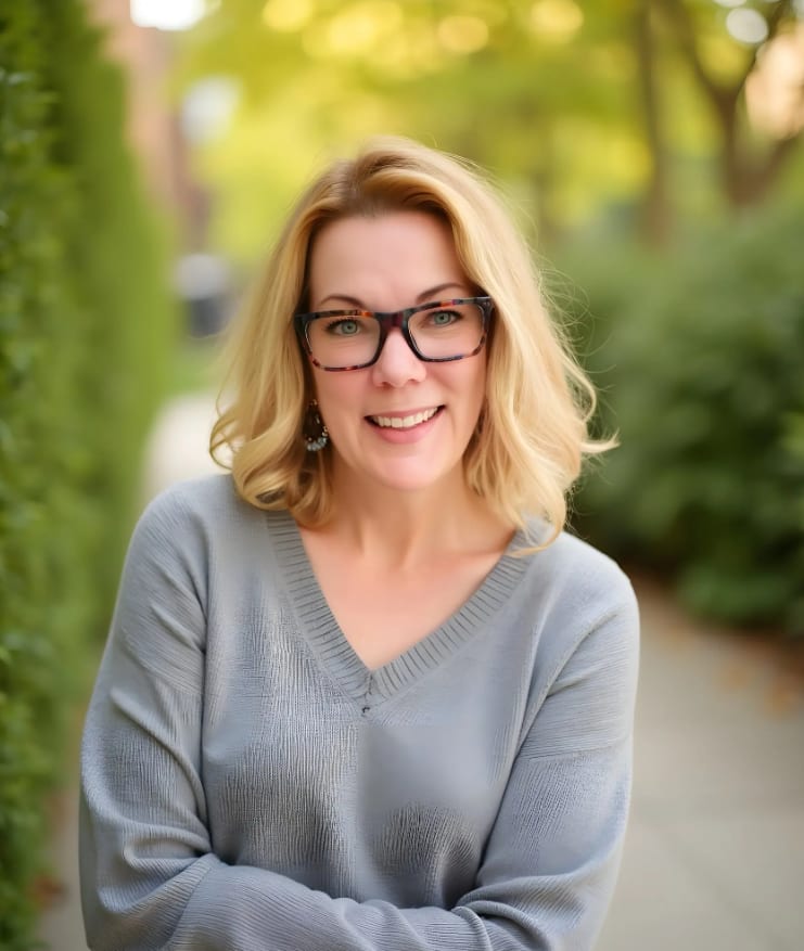 Mediated Online Solutions, LLC Serves Divorcing Couples in All 62 New York Counties Debra Whitson, New York divorce mediator and founder of Mediated Online Solutions, LLC, smiling outdoors in a gray sweater.