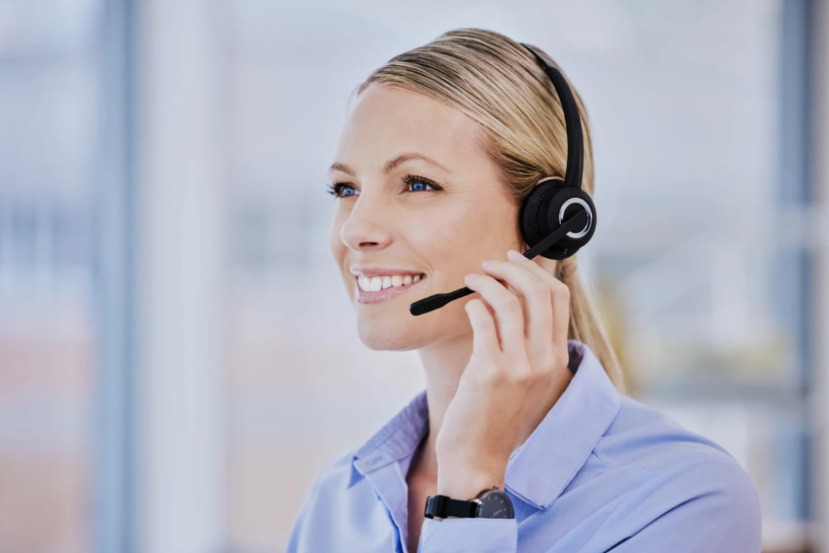 U.S.-based virtual receptionist wearing a headset, answering a call for a law firm client.