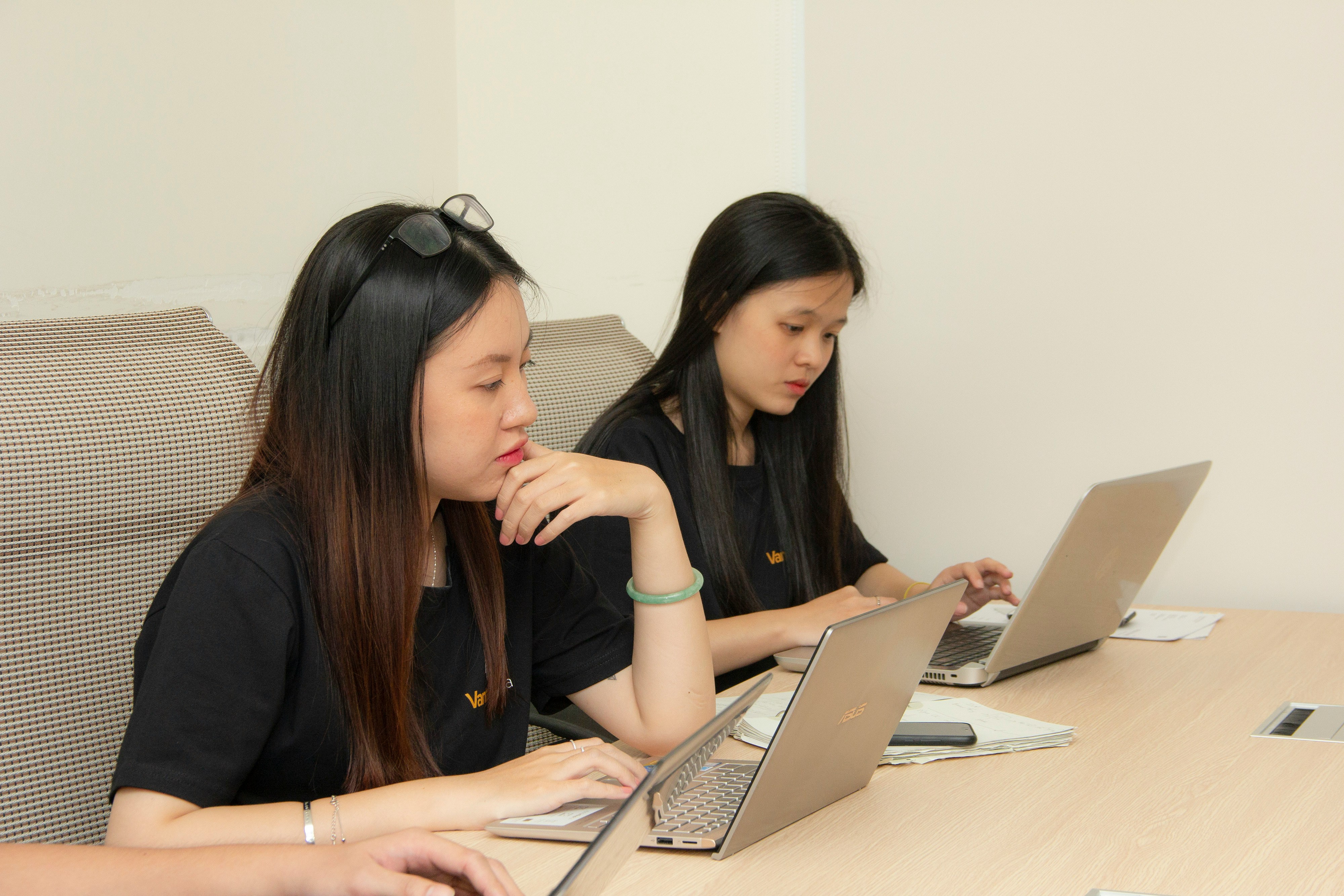 Students accessing digital education resources on various devices, representing KFC's commitment to educational accessibility