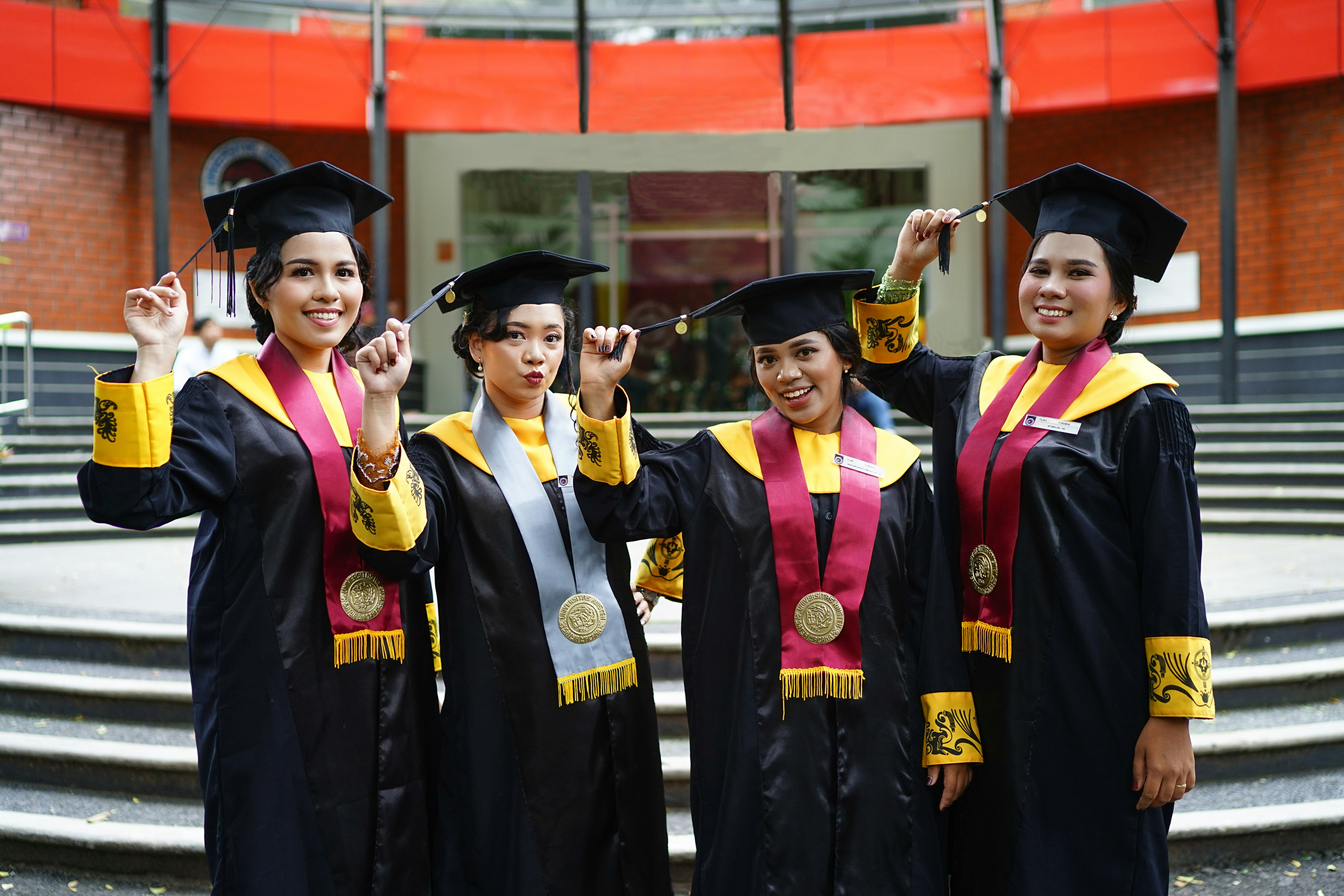 Kingdom Foundation College graduation ceremony with graduates in caps and gowns celebrating their achievement