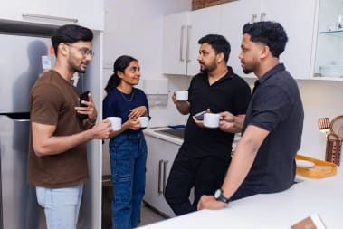 Exline Labs team sharing ideas during a coffee break