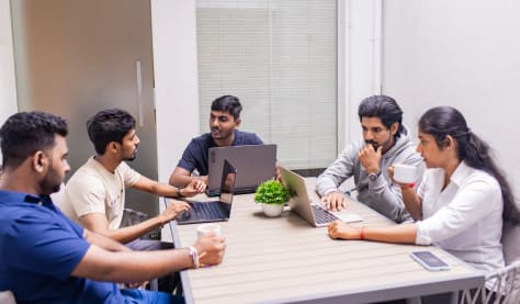 Collaboration session of app creators UK team around office table