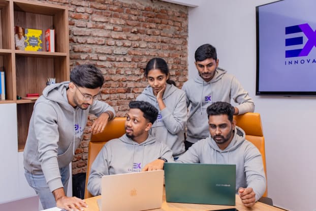 Team of software design consultants at Exline Labs in discussion