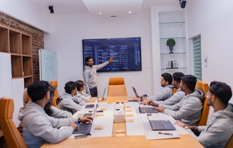 Mobile application design team collaborating during office presentation