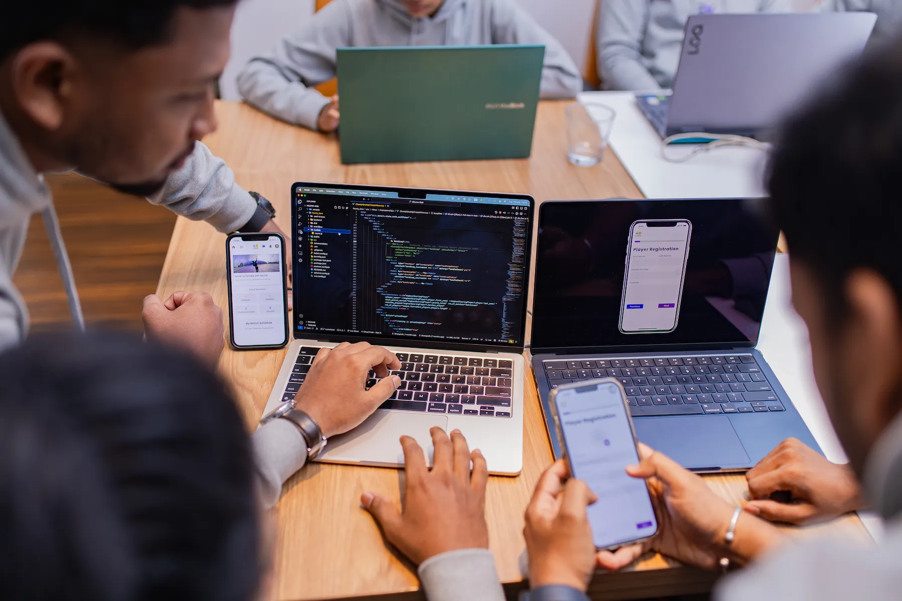 Affordable custom web design professionals working together on laptops