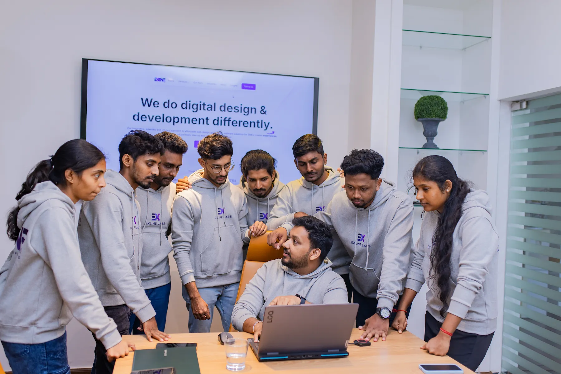 CEO leading discussion on custom software development with team