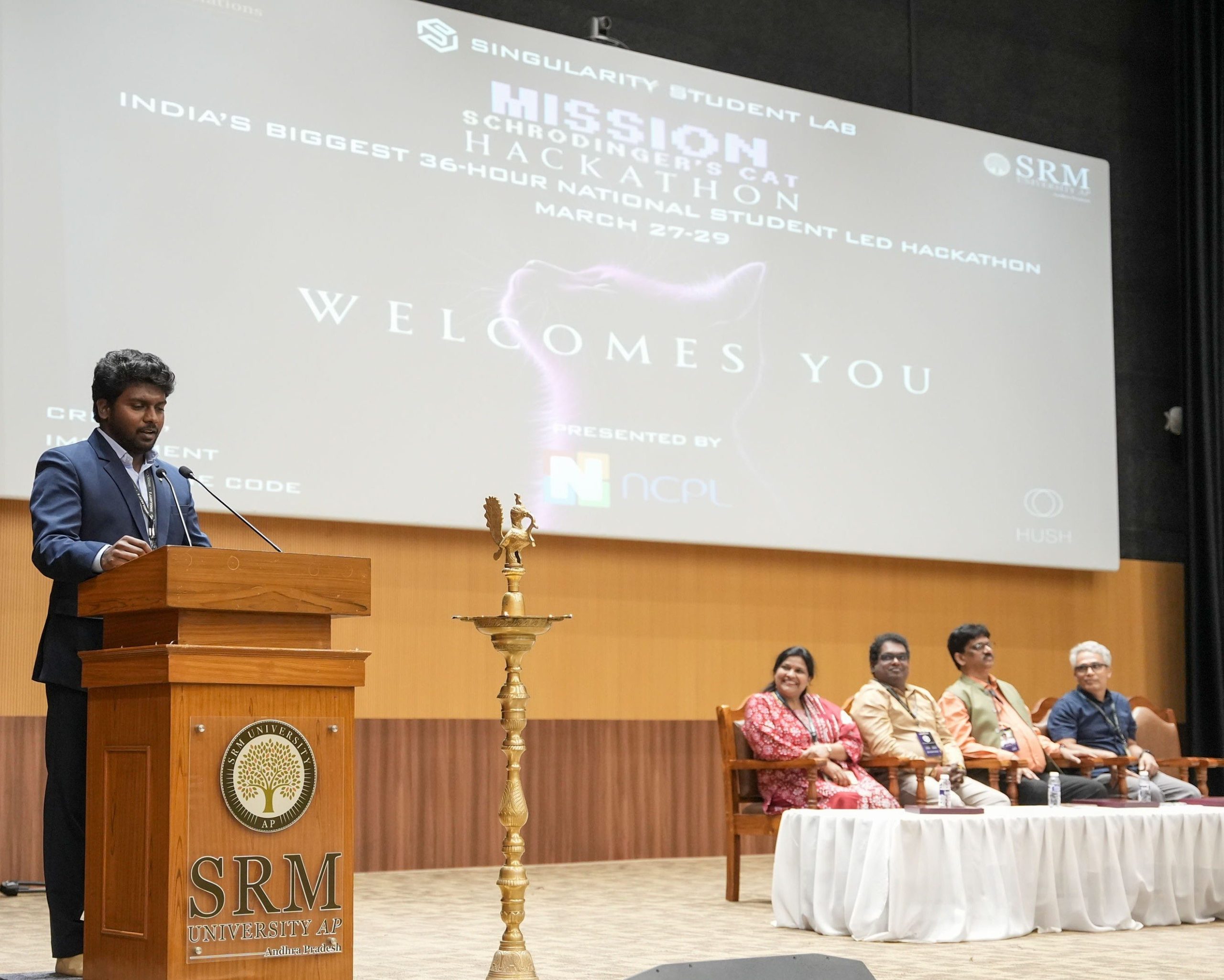 Jayanth Ramakrishnan addressing an audience on stage