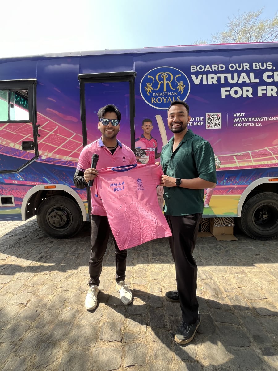 Cricket trivia contest winners receiving signed merchandise