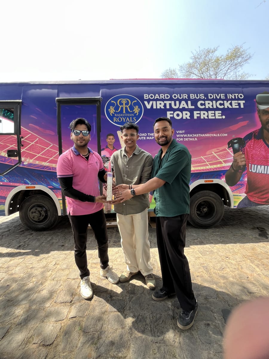 Group photo of participants on the cricket field