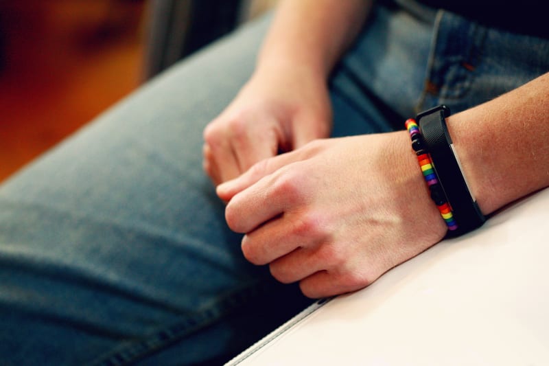 Hands with rainbow pride bracelet