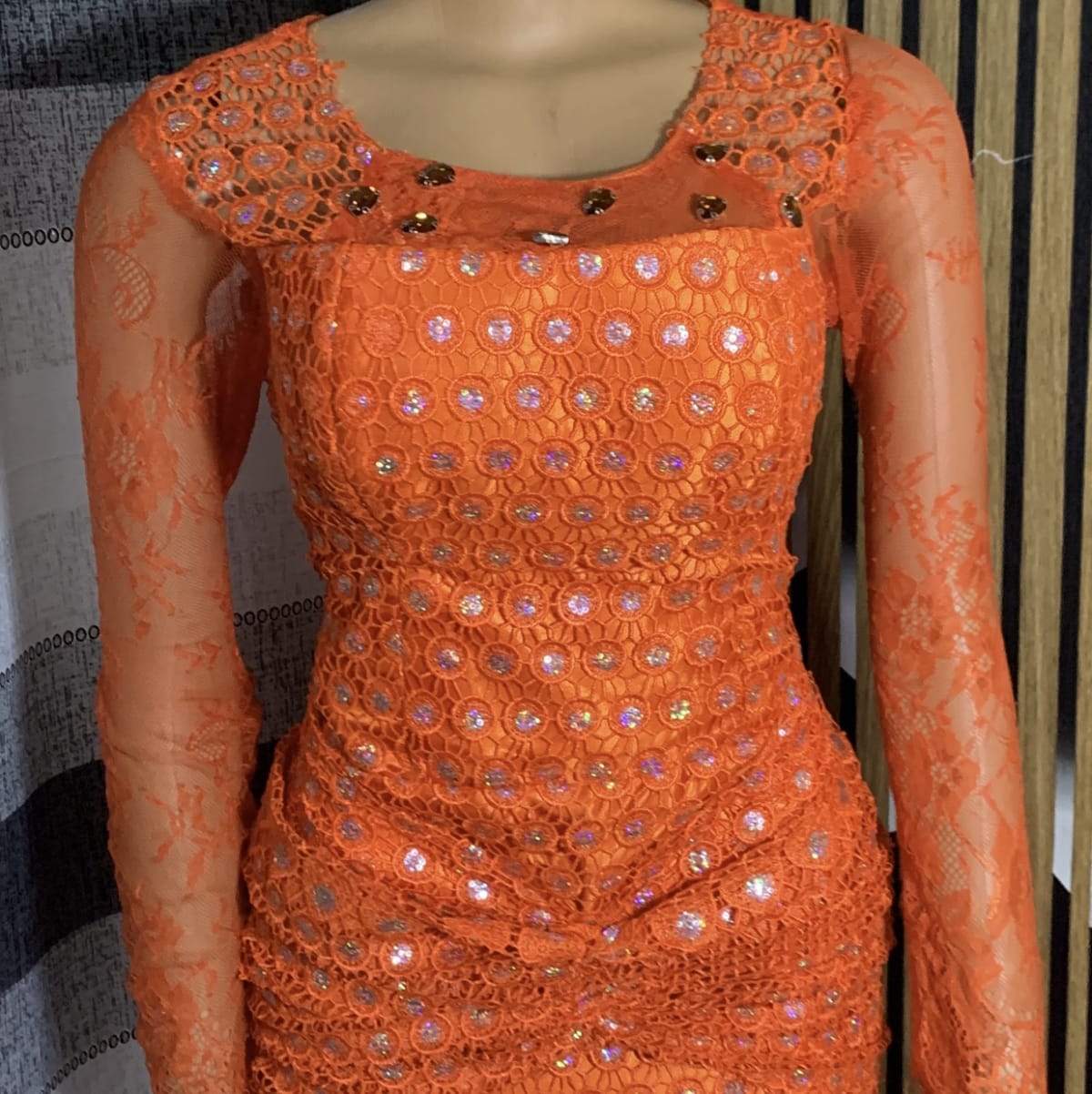 Straight gown with ruffled drape design on the hip