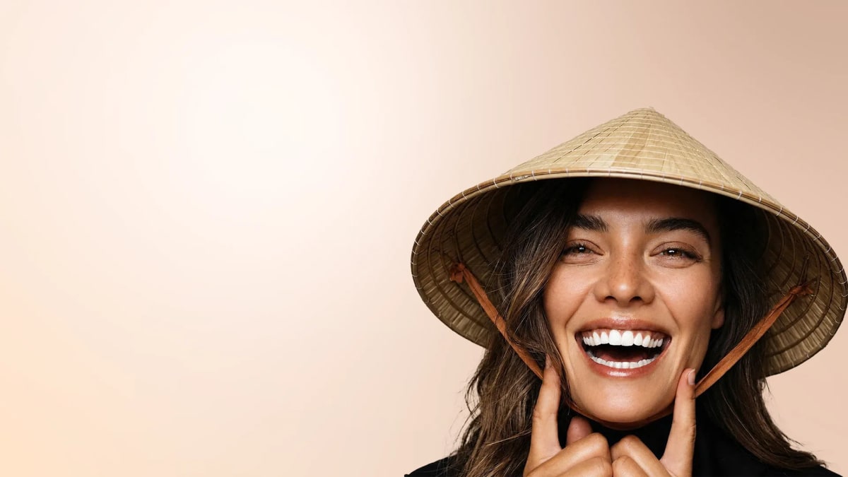 A patient smiling with confidence after dental treatment in Vietnam