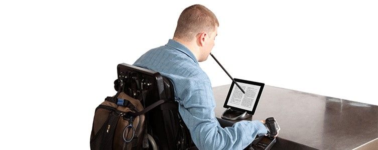 A handicapped person using mouse stick