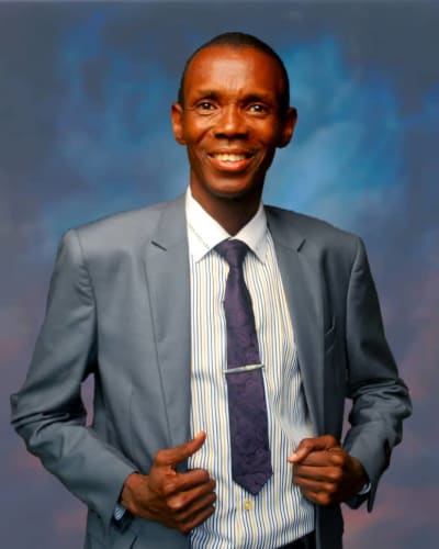 Pastor 'Tunde Olufemi in gray suit