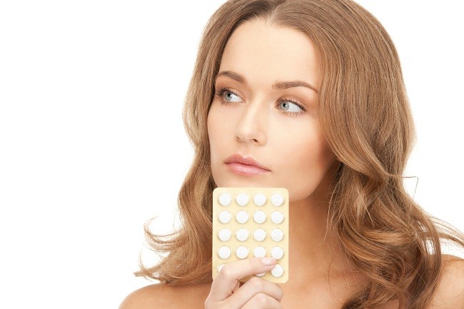 young beautiful woman with pills