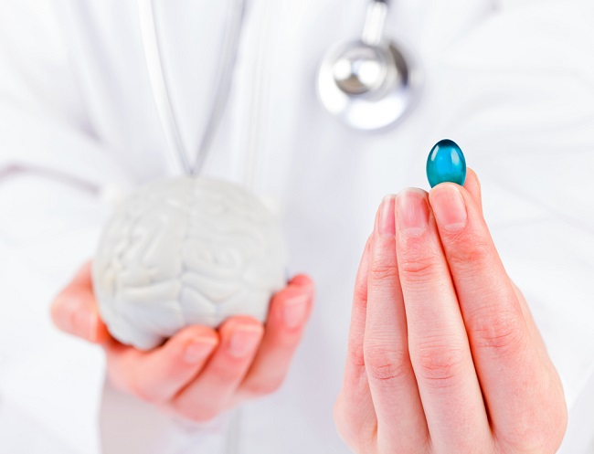 Closeup photo of blue gel capsule in doctor hand