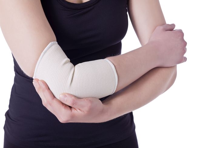 athlete woman having an elbow pain