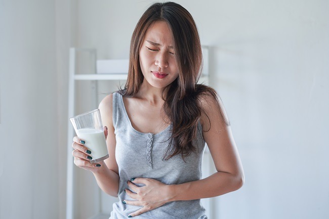 Woman stomach pain on white background