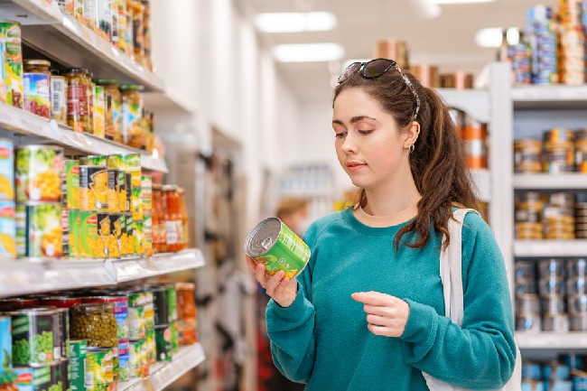 A,Young,Pretty,Caucasian,Woman,Reads,Ingredients,On,A,Tin