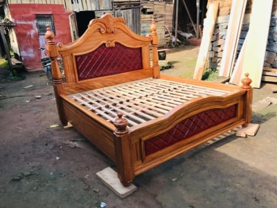 Carved Wooden Bed Frame with Burgundy Panels