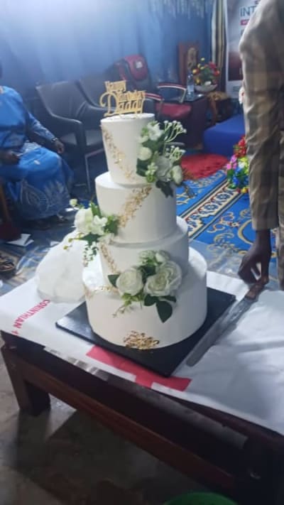 Three-Tier White and Gold Celebration Cake