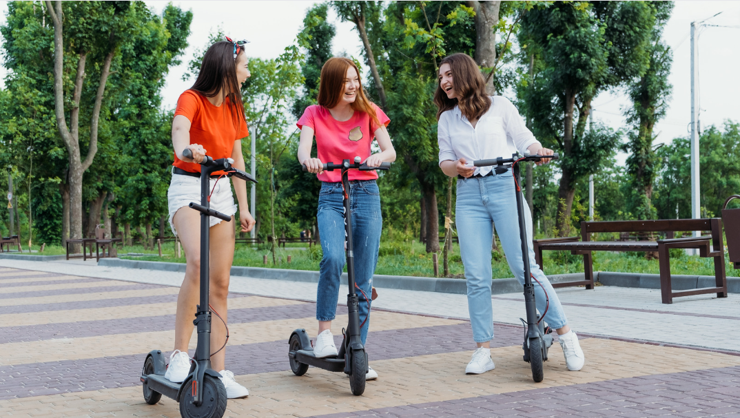girls on park with escooters