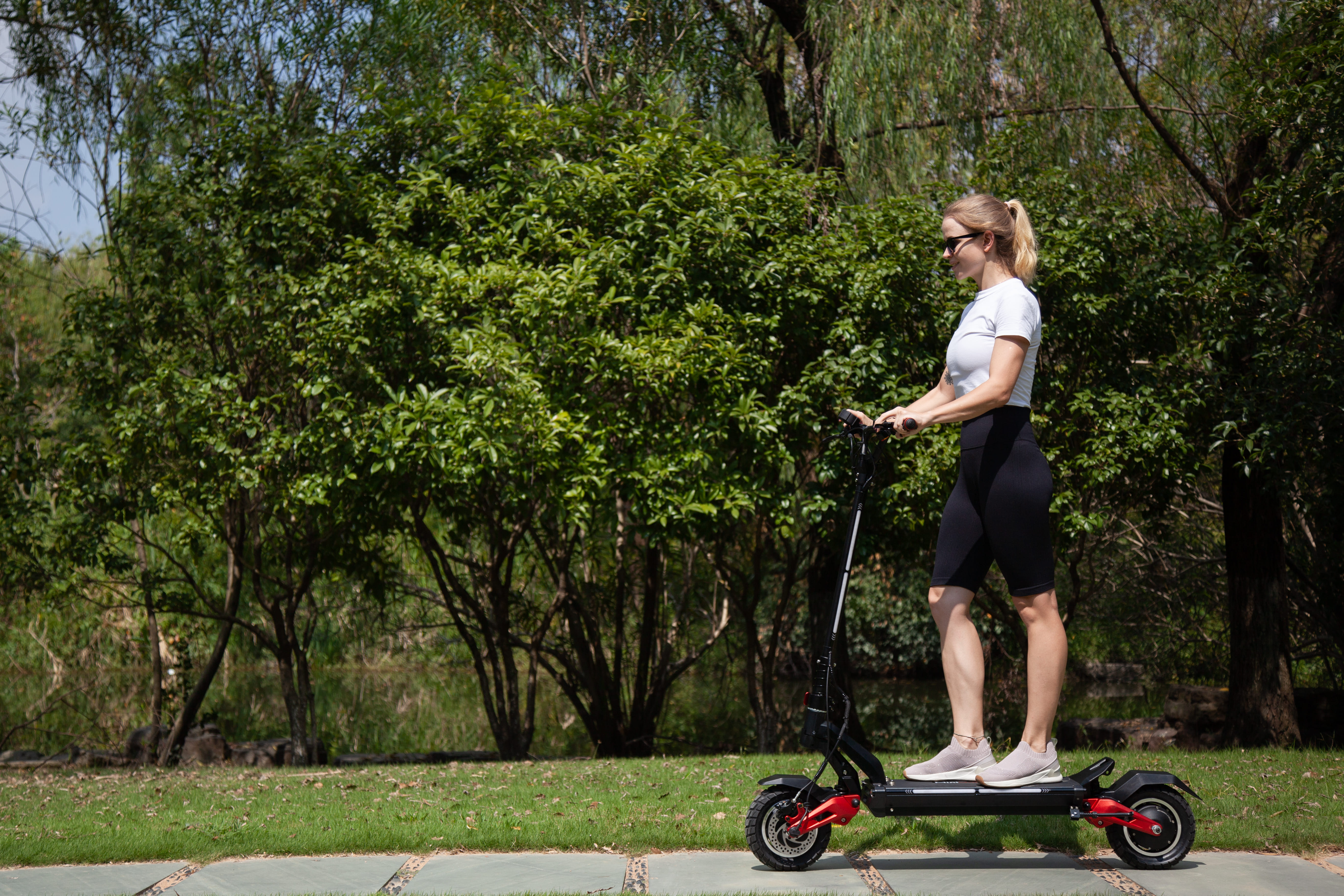 woman riding miniwalker electric scooter