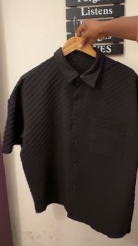 Unisex Stylish Black Textured Ribbed Short Sleeve Button-Up Shirt with Chest Pocket - Versatile Casual & Smart Fashion for Men & Women - View 1