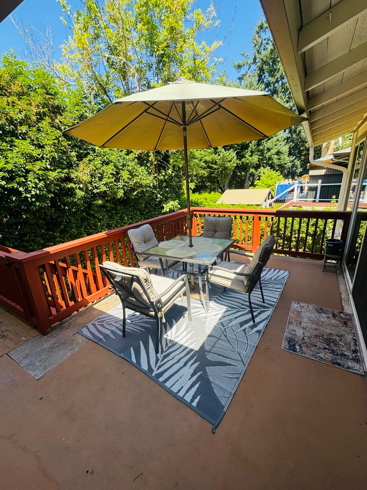 Deck seating area at Bramig Adult Care Home, offering a relaxing space for residents.