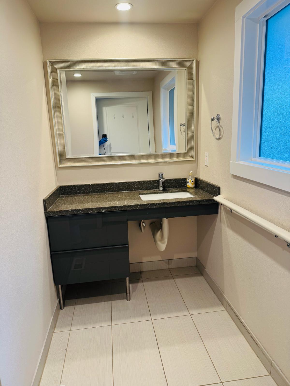 Clean and accessible bathroom at Bramig Adult Care Home.